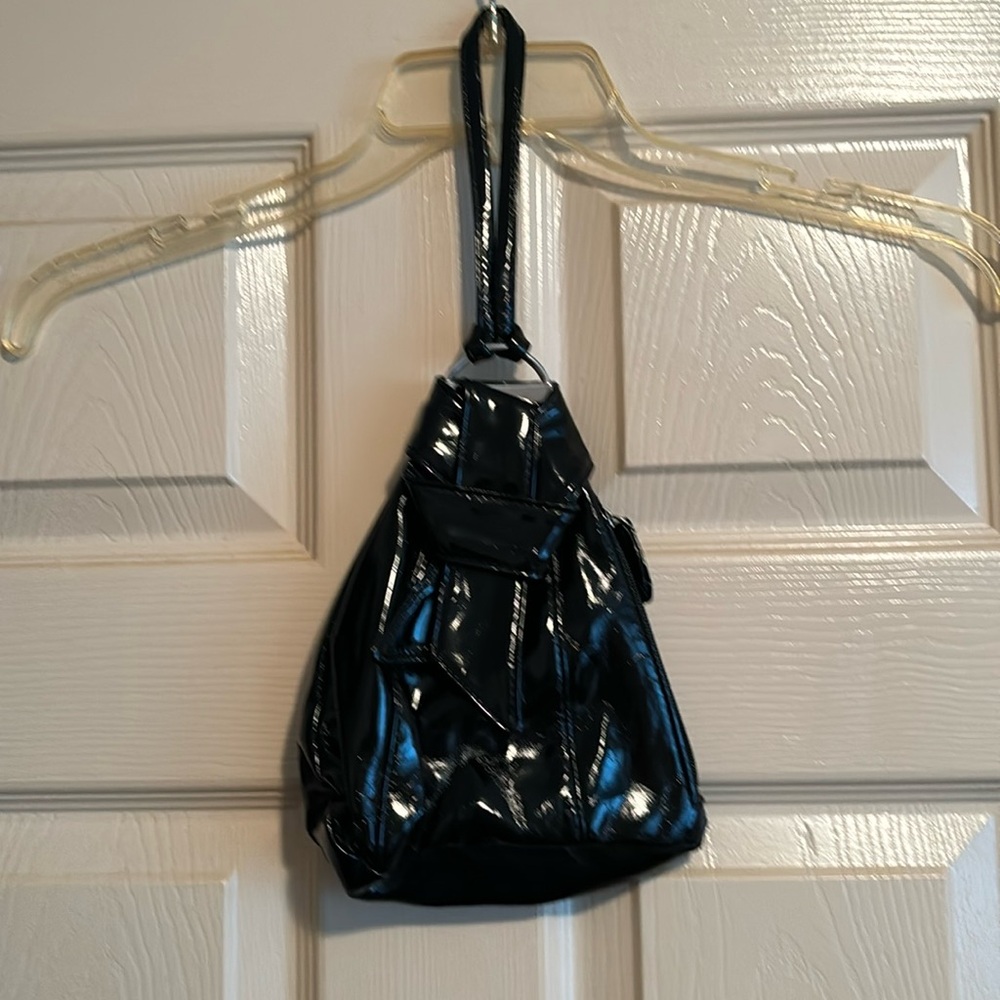 Black Patten leather hand held purse.